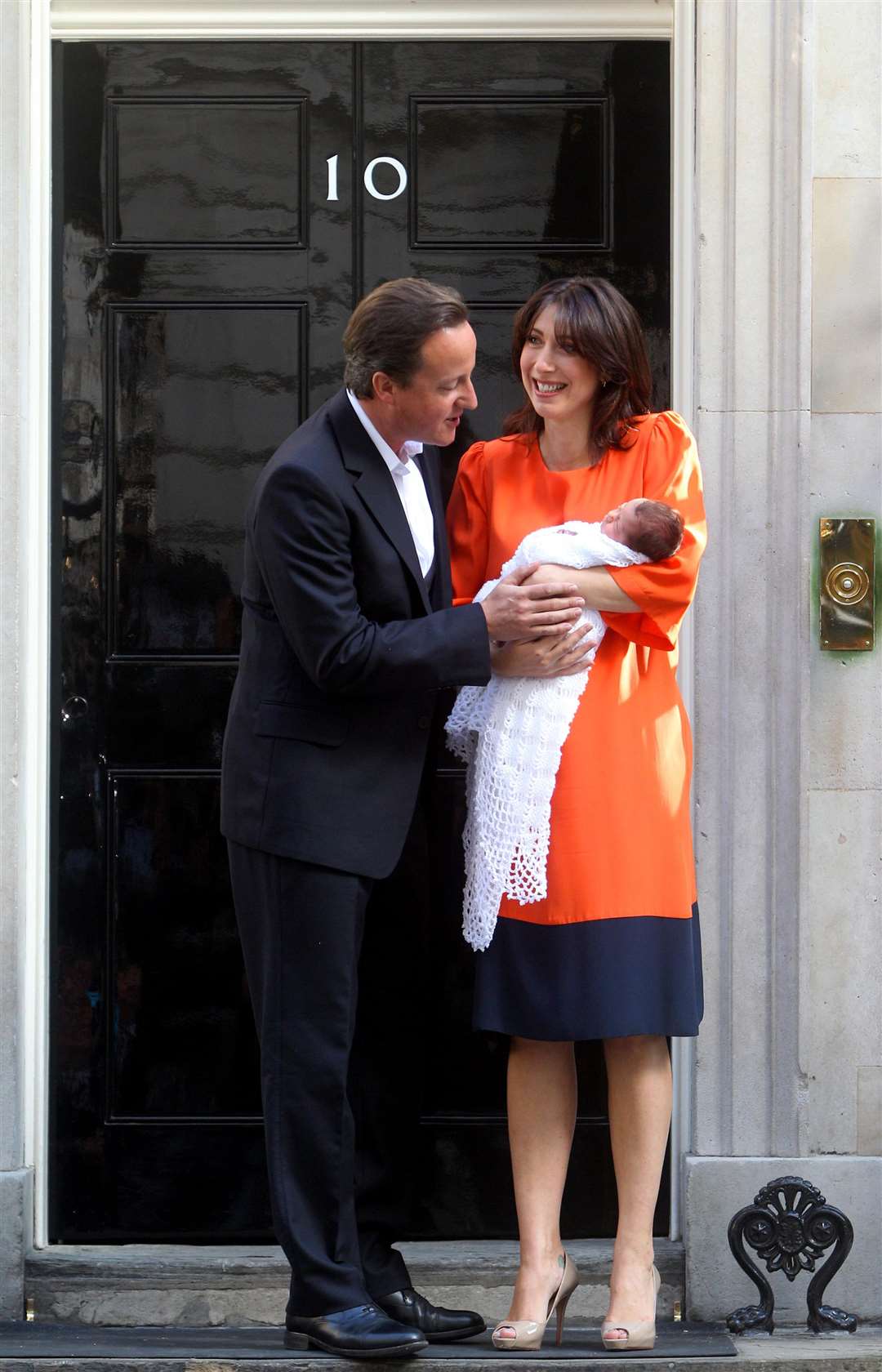 David Cameron and his wife Samantha holding their baby daughter Florence Rose Endellion Cameron outside 10 Downing Street (Lewis Whyld)