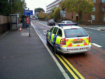 Police cars at the scene in The Overcliffe