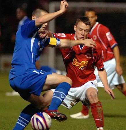ALL ARMS AND LEGS: Crewe's Gary Roberts goes in for a challenge with Gillingham's Andrew Crofts. Picture courtesy Staffordshire Sentinel News & Media