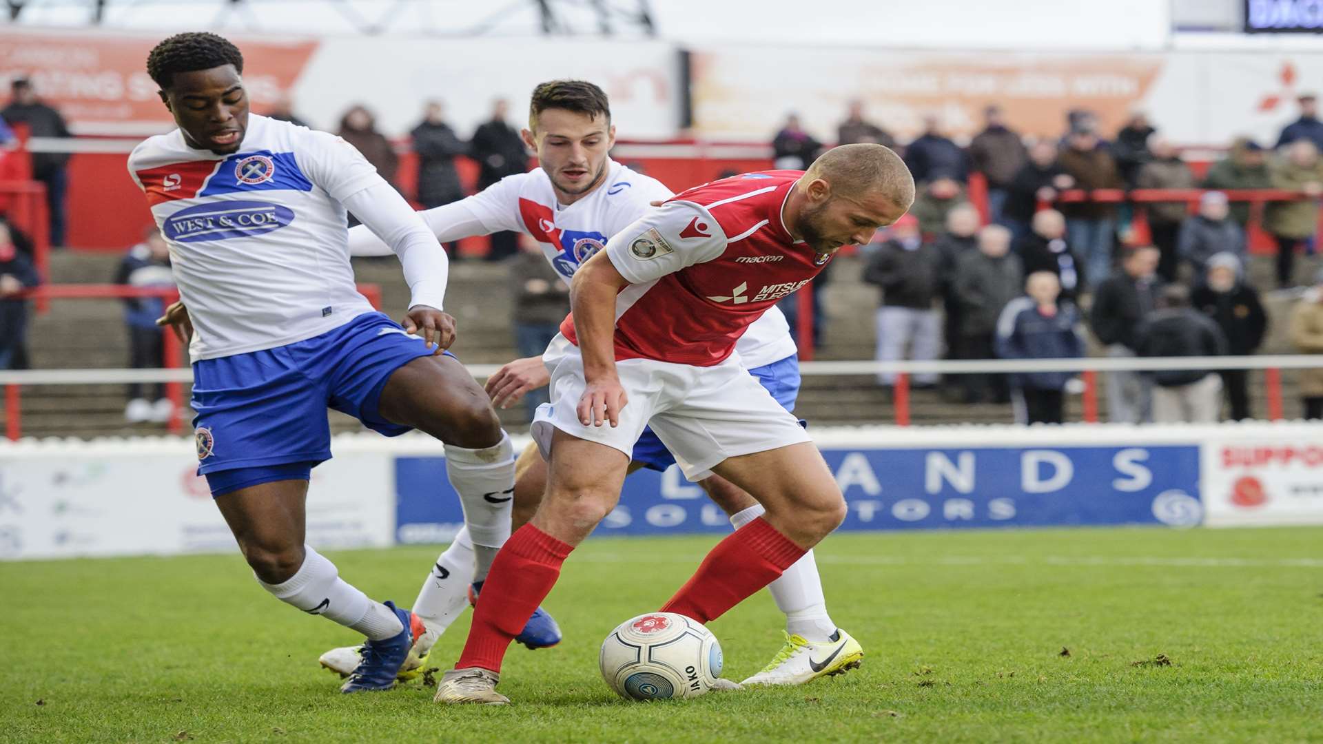 Fejiri Okenabirhie tries to dispossess Luke Coulson during Ebbsfleet's draw with Dagenham earlier this season Picture: Andy Payton