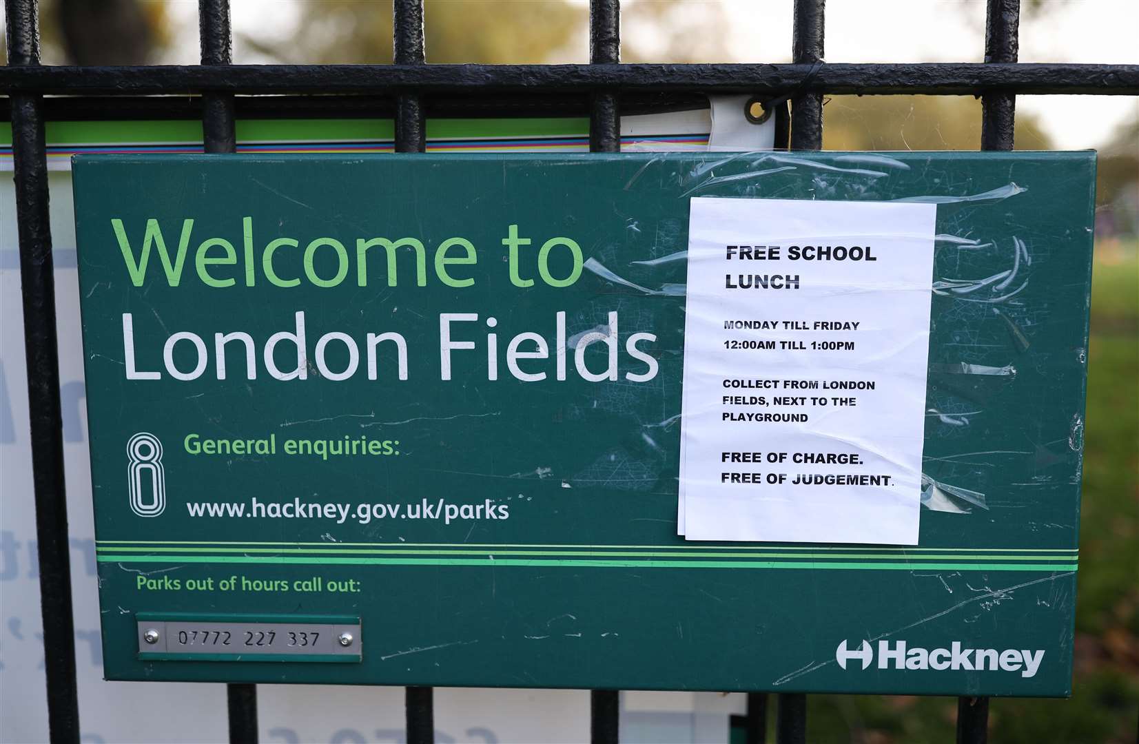 London Fields Primary School in Hackney, London, is offering free lunches over the break, with a sign reading ‘Free of charge. Free of judgement’ (Yui Mok/PA)