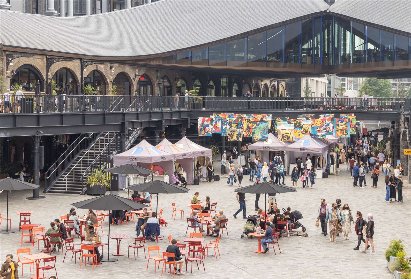 The Drops Fashion Market at Kings Cross with Bethany Williams' art project in the image