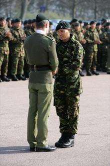 Lt Col Gez Strickland congratulates acting Sgt Dip Pun who recieved the Conspicuous Gallantry Cross. The 1st Battalion Gurkha Rifiles recieve awards in the military honours list. Shorncliffe barracks, Shorncliffe, Folkestone.