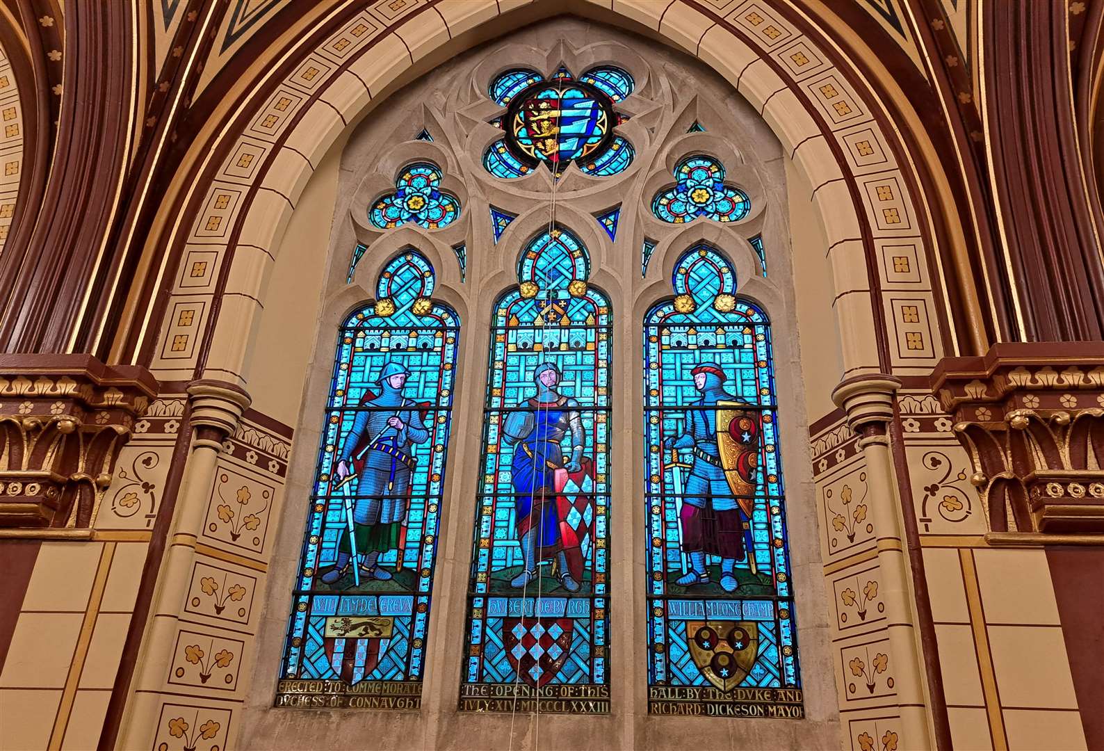 One of the stained glass windows on the balcony overlooking the Connaught Hall of the Maison Dieu