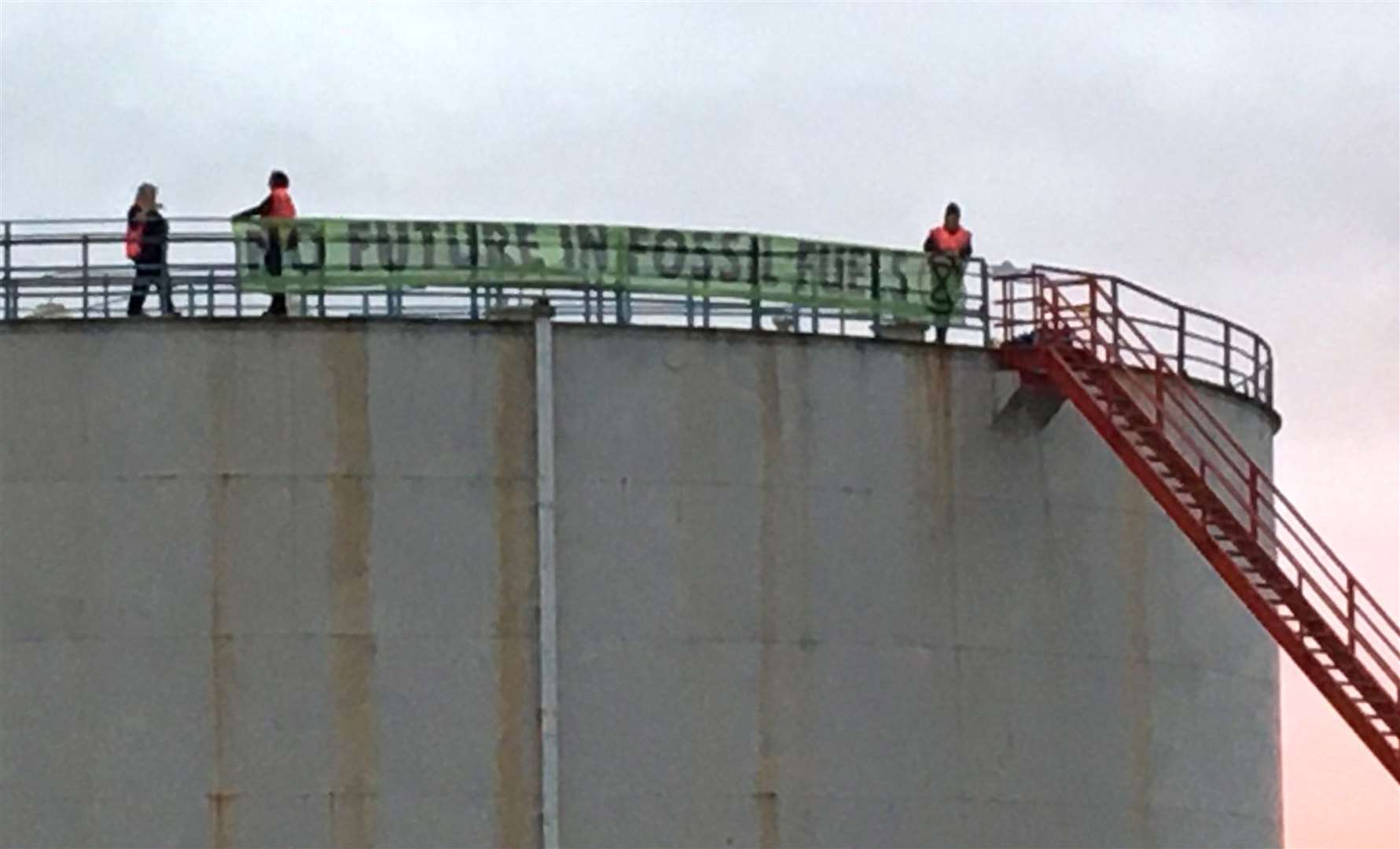 Protesters who have broken into ExxonMobil’s Fawley Oil terminal, in Hampshire (Extinction Rebellion/PA)