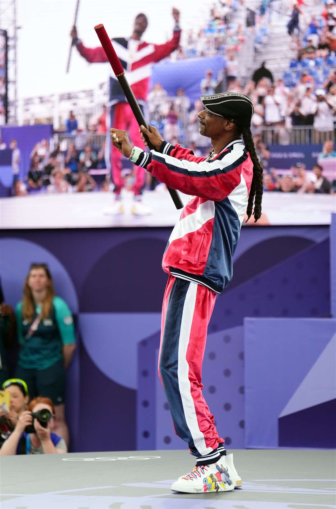 Rapper Snoop Dogg with the brigadier, used in the theatre to mark the opening of a performance, at the 2024 Paris Olympic Games (John Walton/PA)