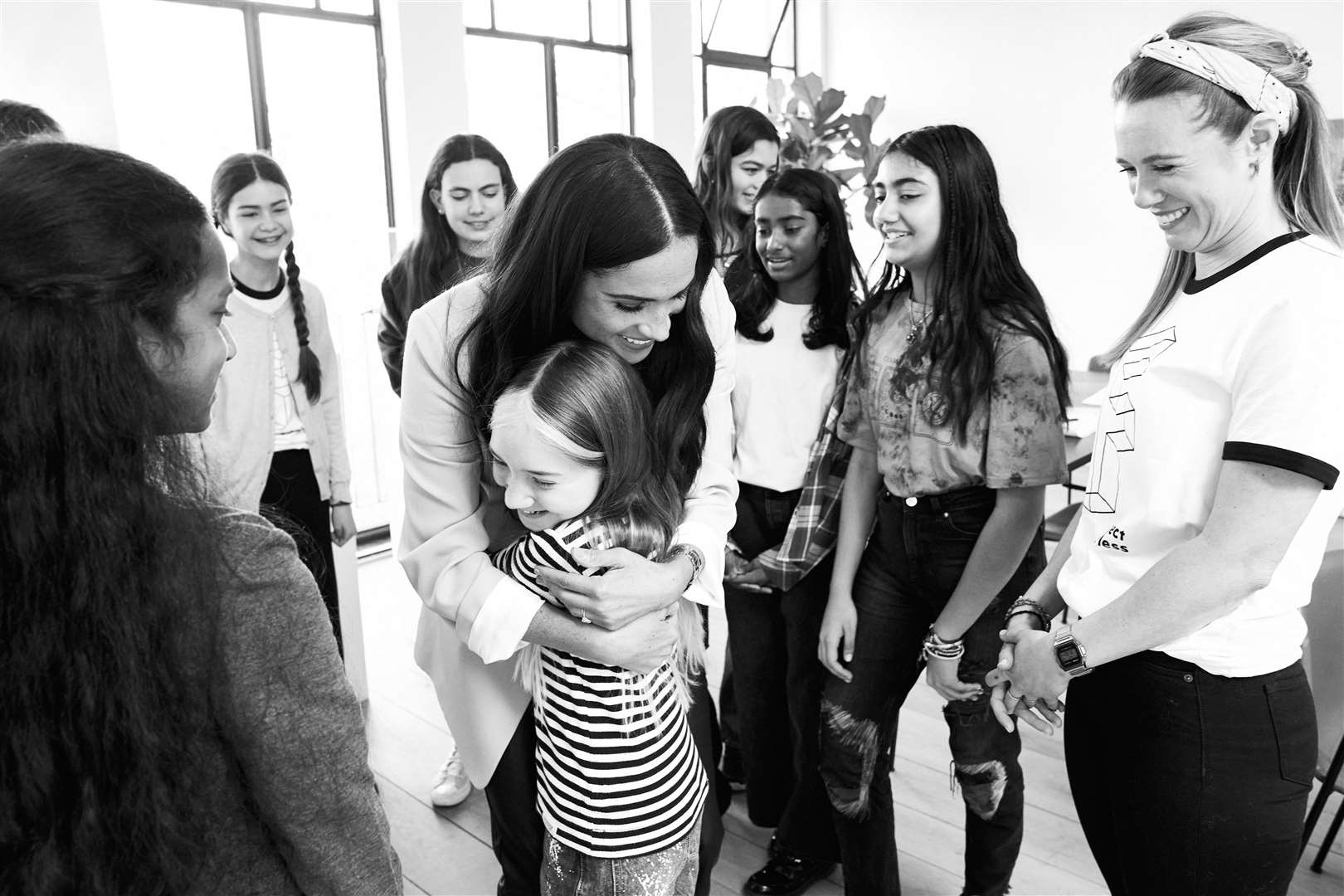 Meghan hugging one of the participants (Chris Allerton/Archewell/PA)