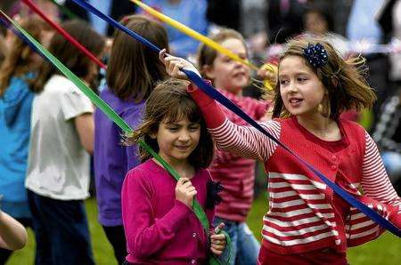 Maypole dancing takes place at Kent Life