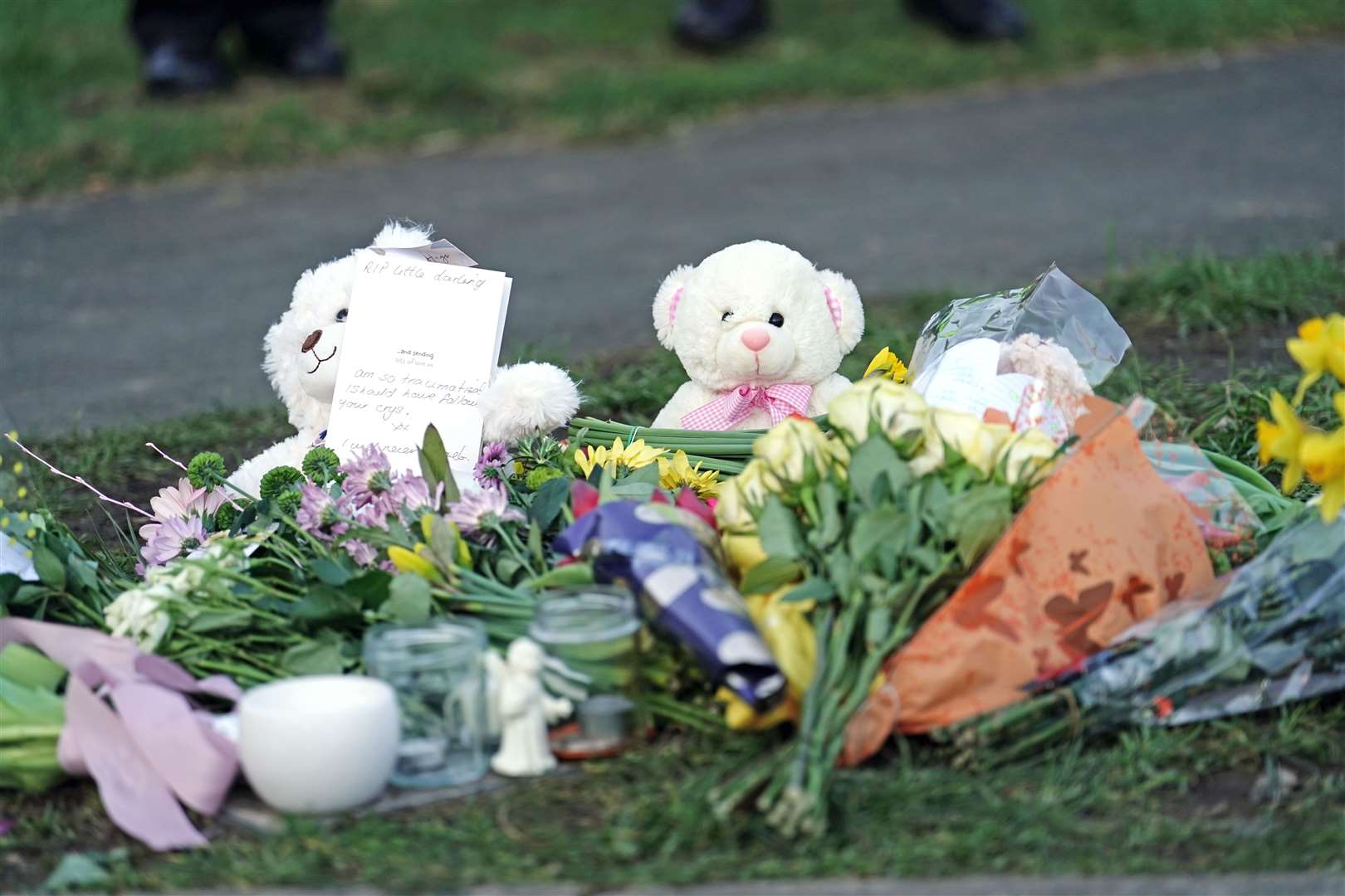 Teddy bears and flowers were left at the scene on Thursday (Jordan Pettitt/PA)