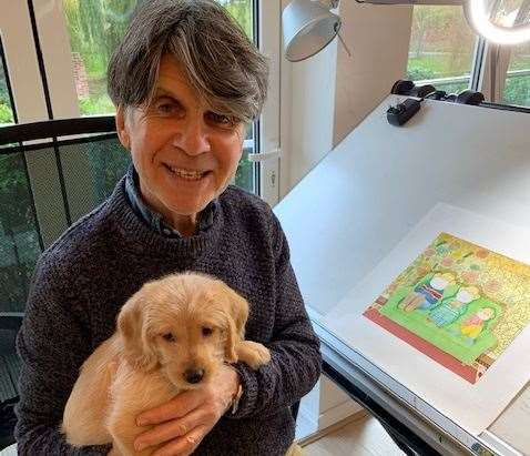 Anthony Browne is distracted from his work by new puppy Albert