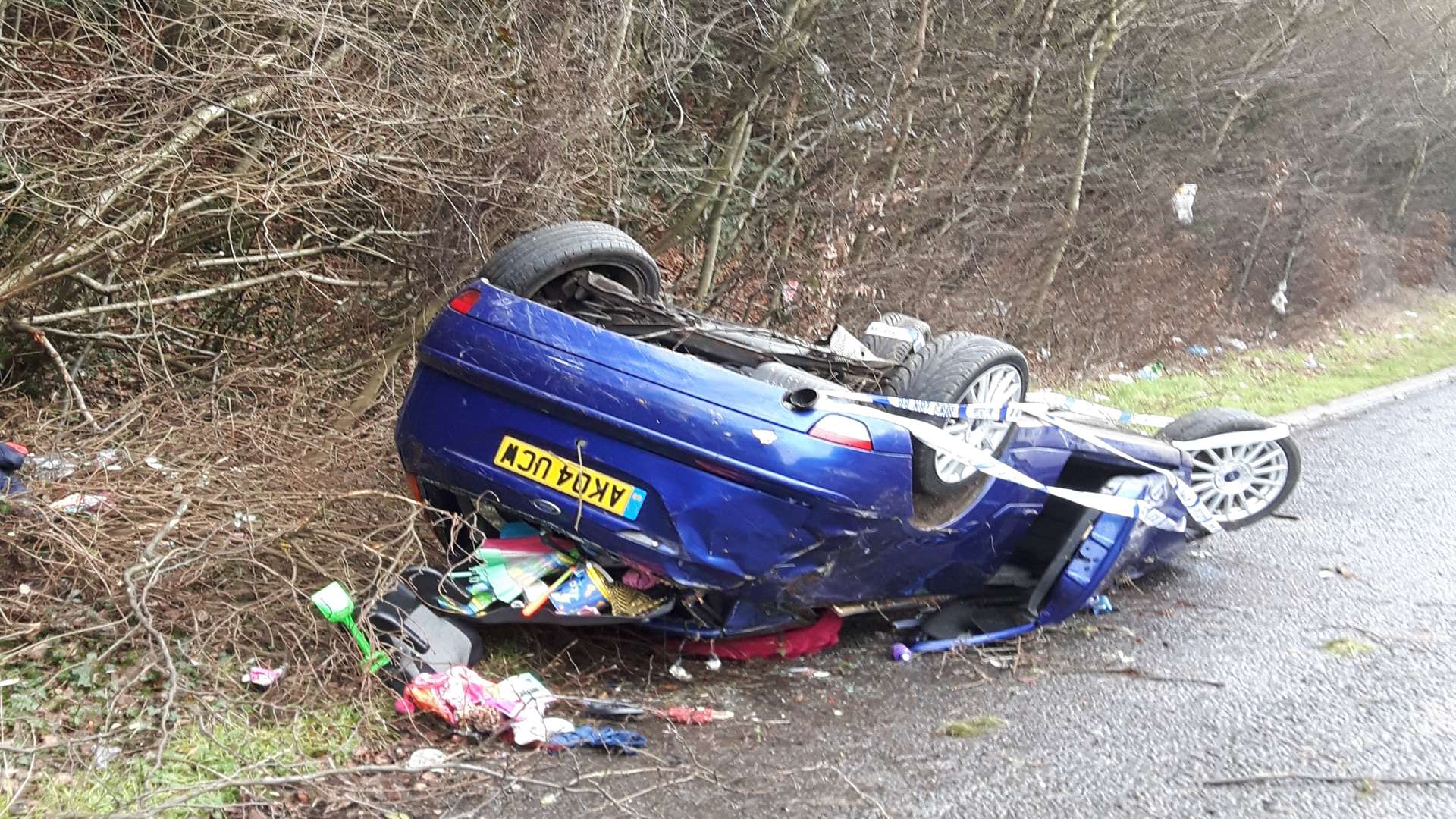 The overturned car on the A249