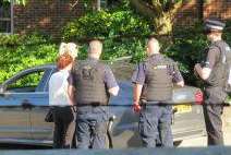 Police surround a car found in Rainham with bullet holes. Picture: Chris Ferguson