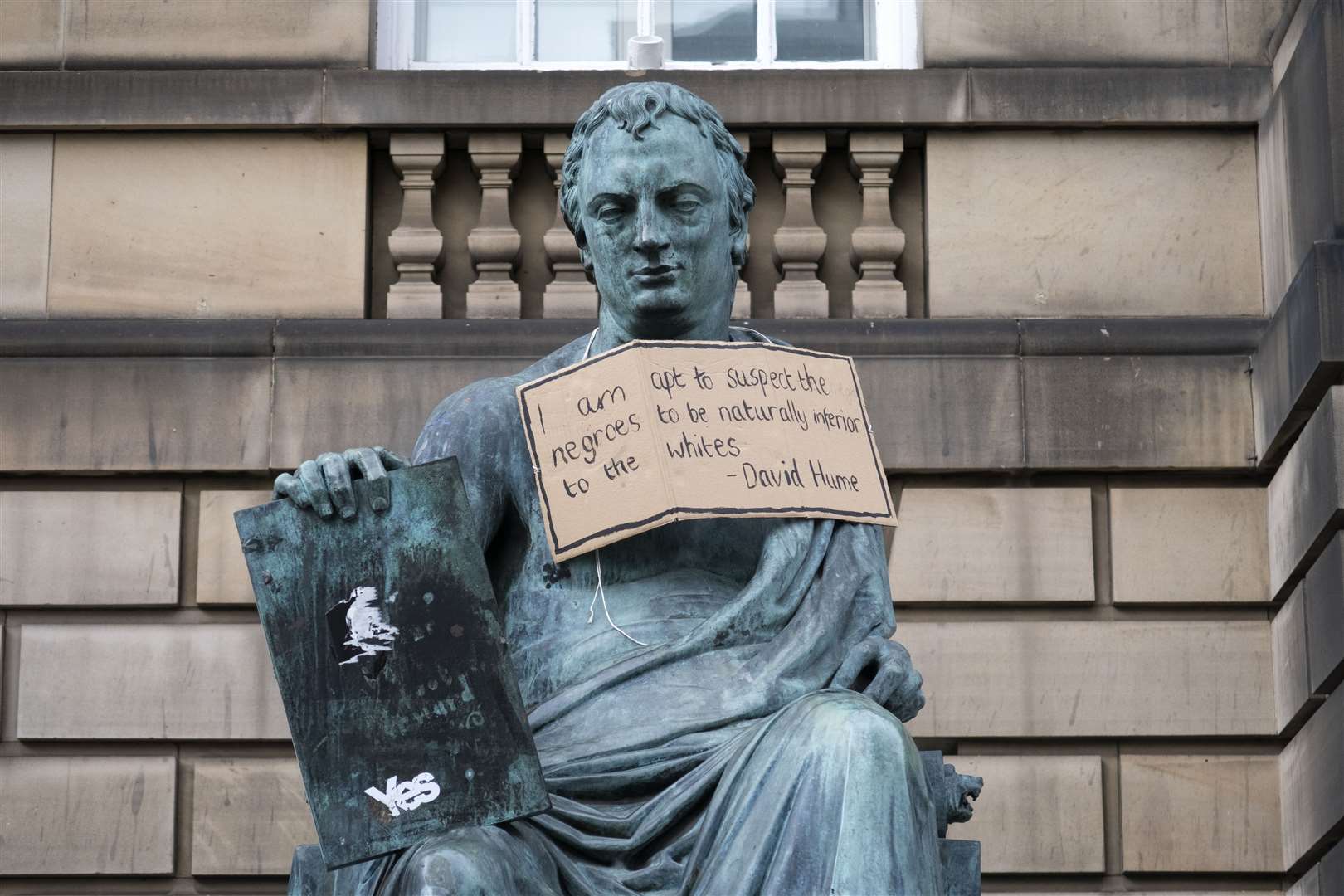 A poster hangs from the statue of David Hume on the Royal Mile, Edinburgh, following a Black Lives Matter protest (Jane Barlow/PA)