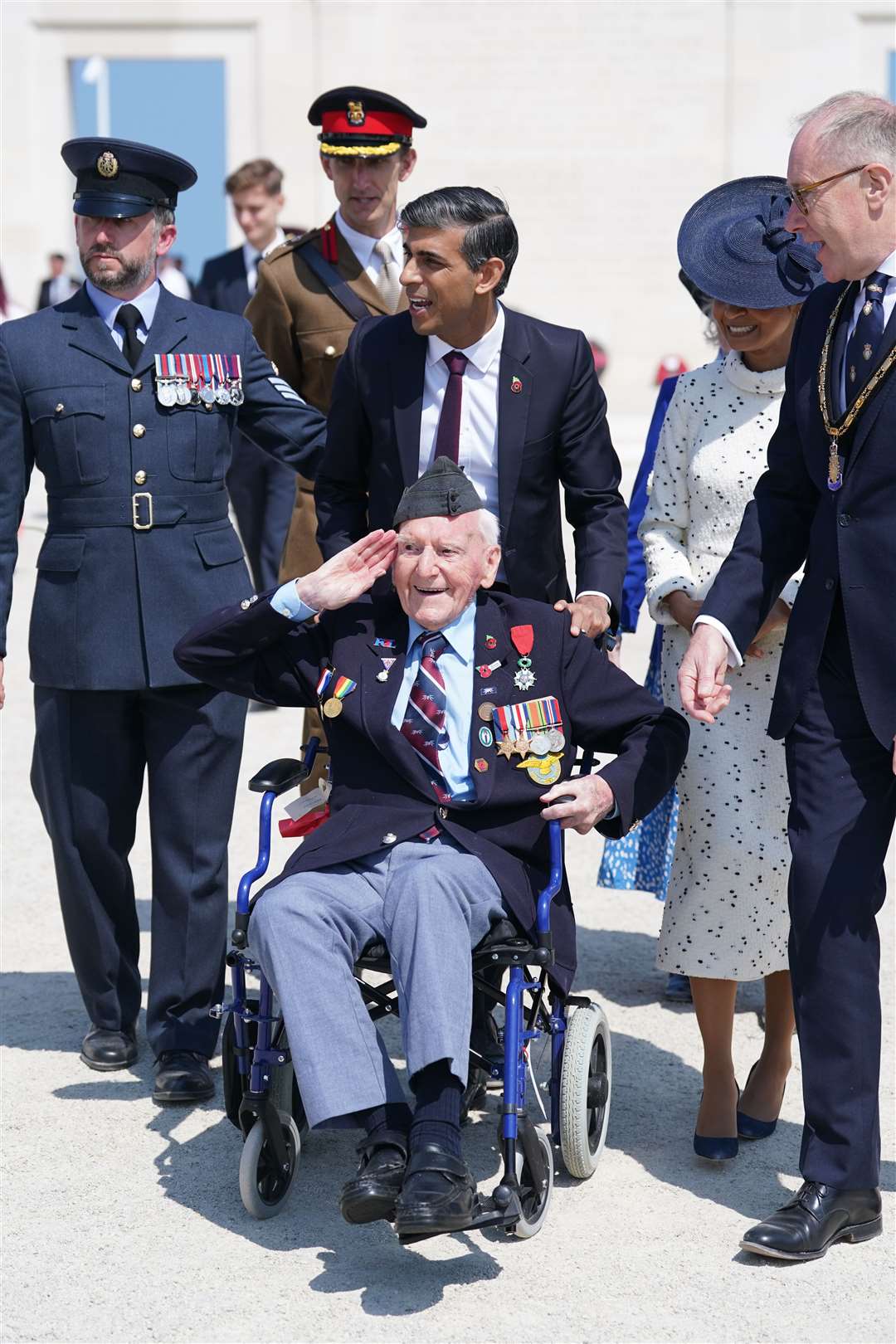 Prime Minister Rishi Sunak wheels Mr Morgan as they head to lunch following the UK national commemorative event for the 80th anniversary of D-Day (Gareth Fuller/PA)