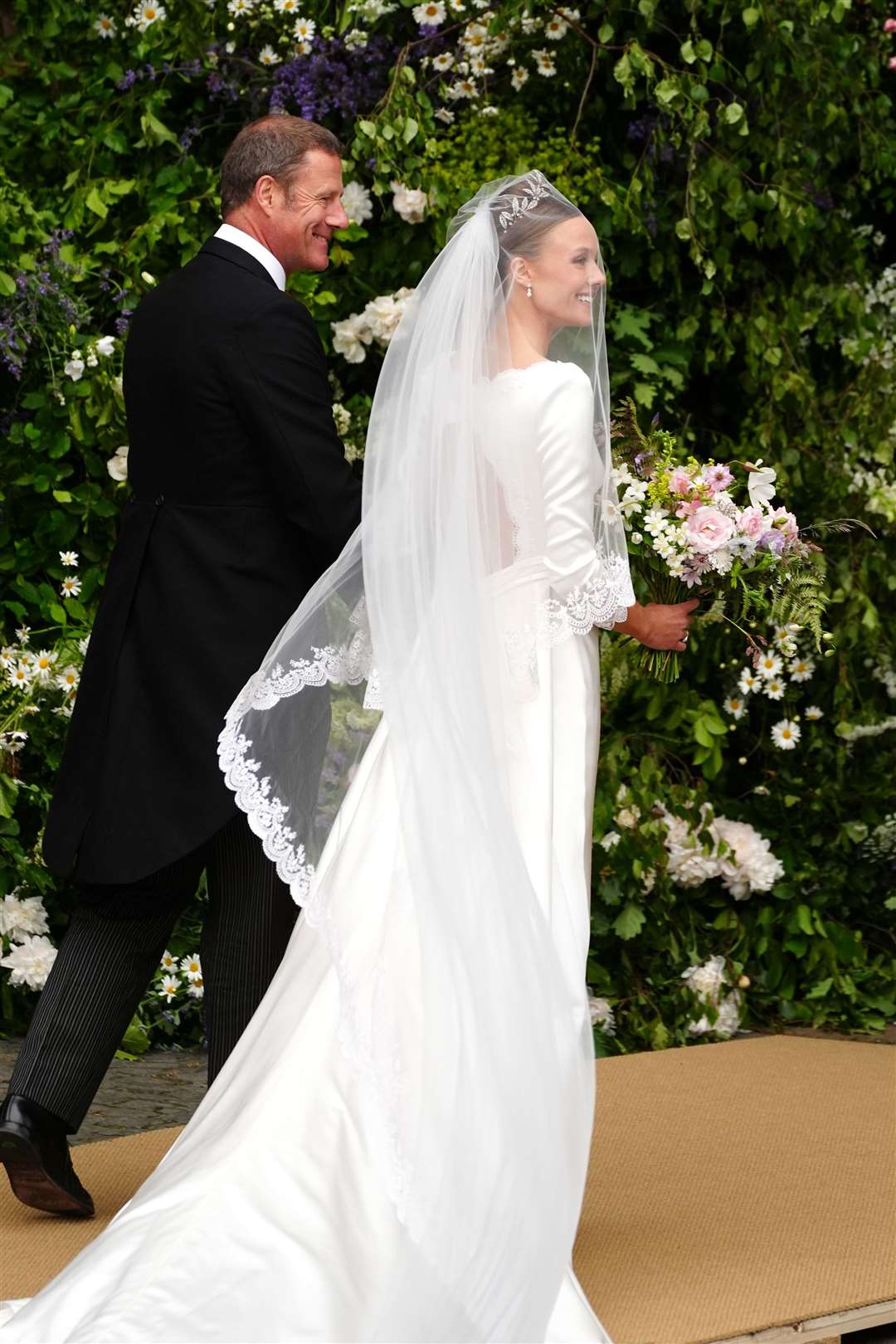 Olivia Henson, with her father Rupert Henson, arrives for her wedding to Hugh Grosvenor, the Duke of Westminster, at Chester Cathedral (Peter Byrne/PA)