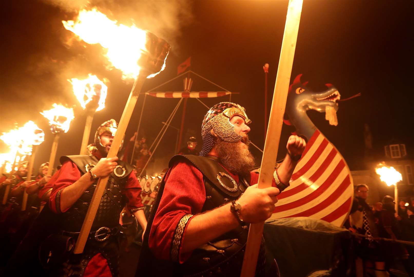 The Guizar Jarl squad march ahead of the burning of the galley during Up Helly Aa 2020 (Andrew Milligan/PA)