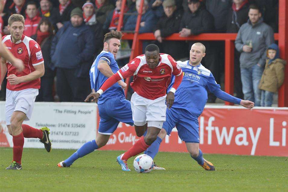 Anthony Cook skips past two Bishop's Stortford players Picture: Andy Payton