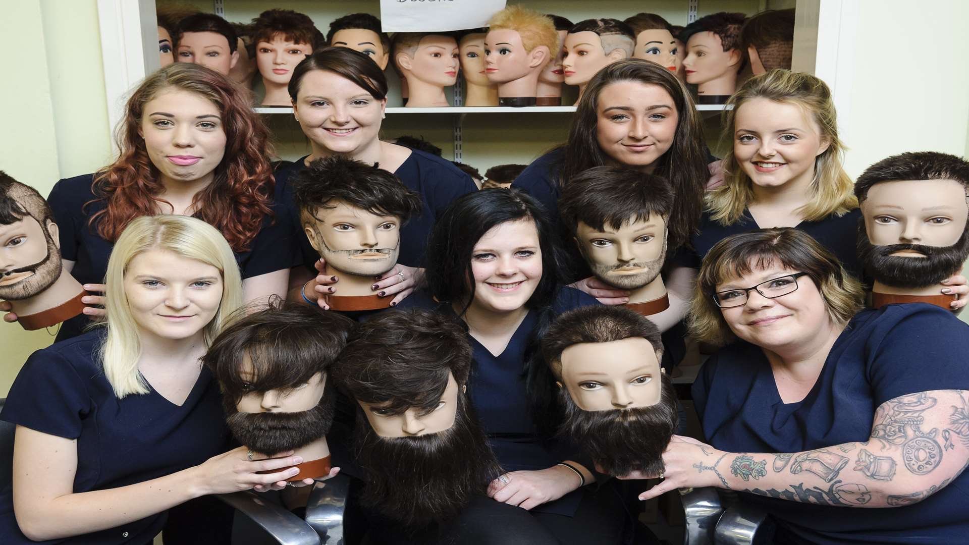 Back from left, Rebecca Cheeseman, Charlotte Miller, Rebecca Outran and Abbie Lockyer. Front Chloe Maguire, Lauren Hart and Kaz Smith. Level Three Barbering students from North Kent College are preparing a calendar for charity, with the photoshoot of their male models taking place next week