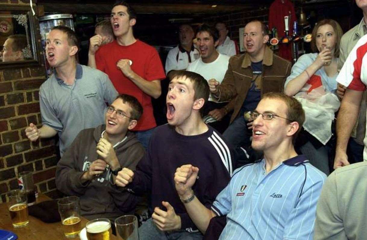 Fans at the Cross Keys pub in Canterbury watch England defeat Australia in the Rugby World Cup final in November 2003