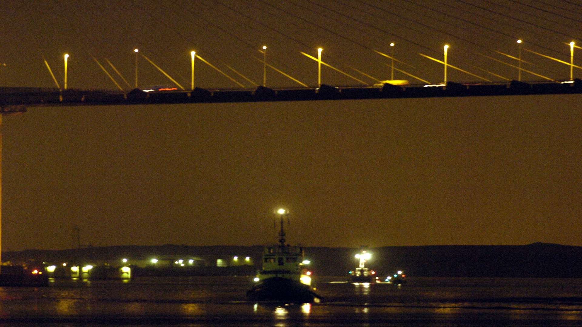 The whale being transported under the QEII bridge.