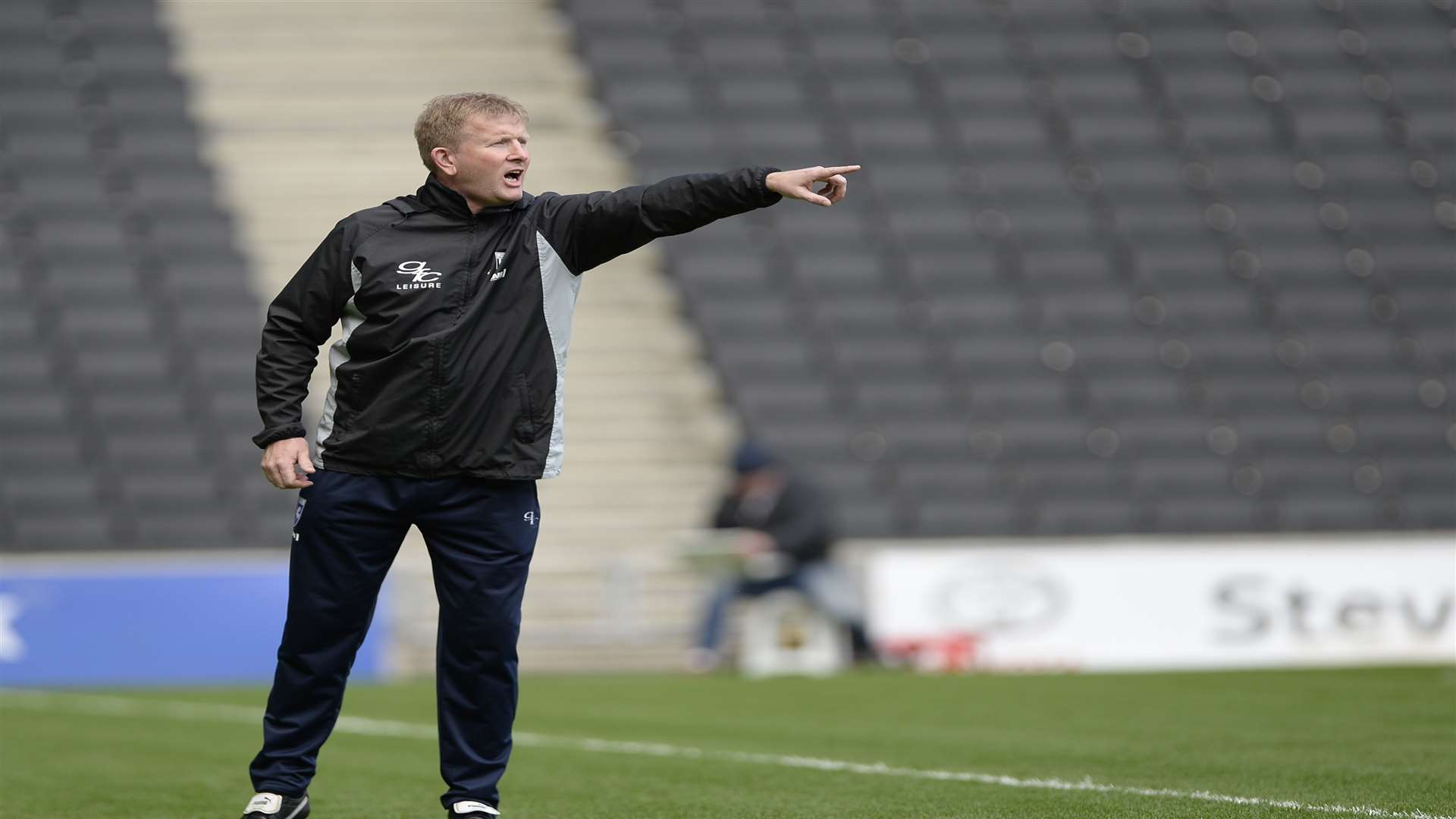 Gillingham boss Ady Pennock reacts to their late defeat against ...