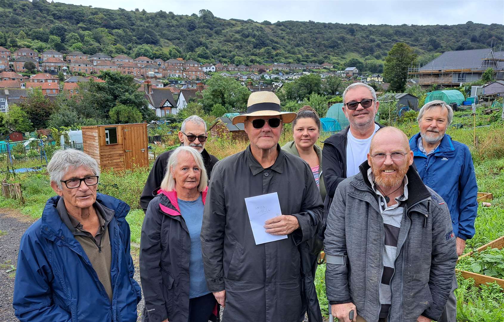 Protesting crop growers and town councillor Graham Wanstall, centre, at Maxton Allotments, Dover