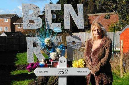 Ben's mum Ruth Jayes pictured with the memorial to her son in her garden.