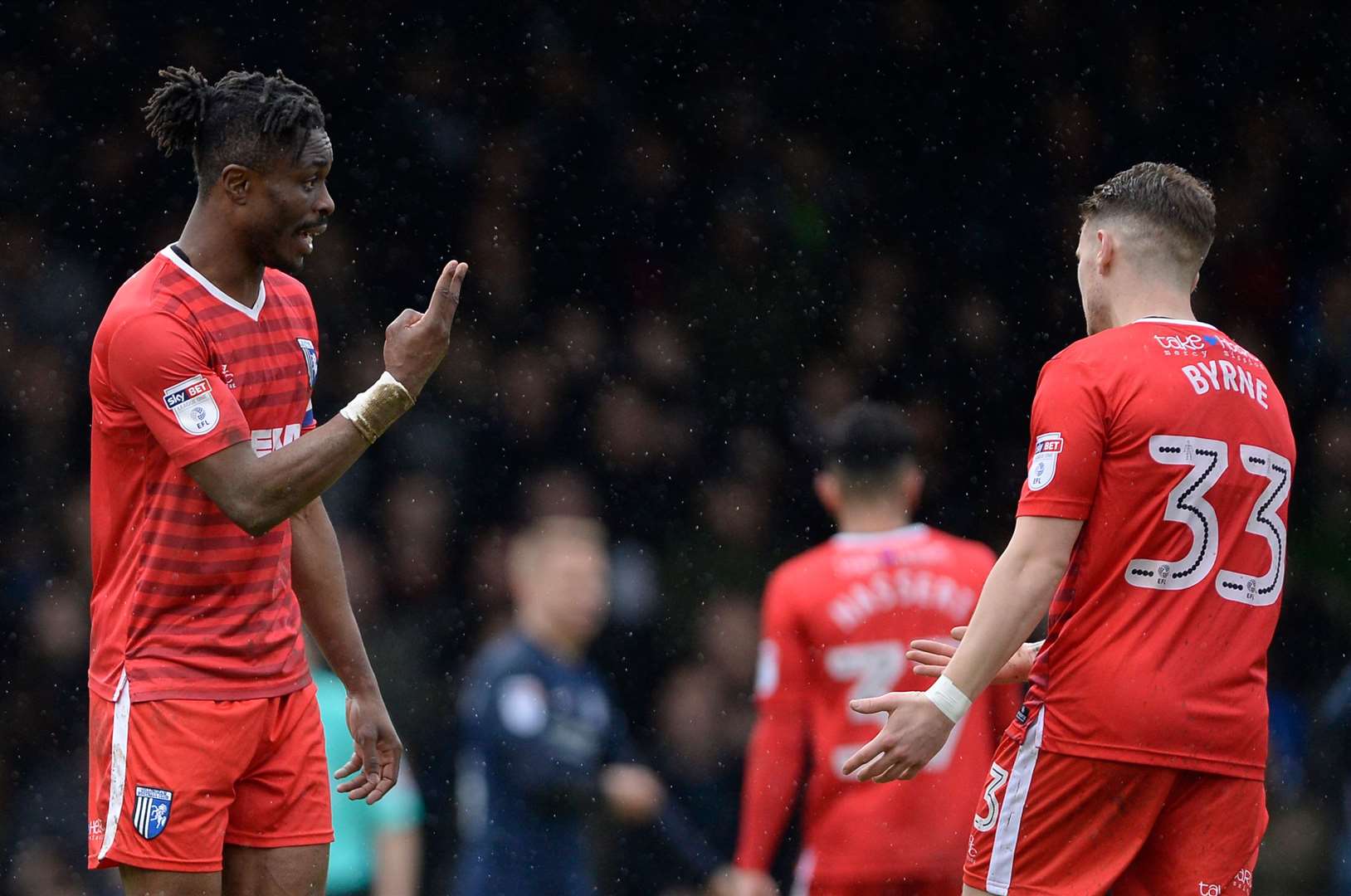 Gillingham's Gabriel Zakuani and Mark Byrne have an exchange of views against Southend Picture: Ady Kerry