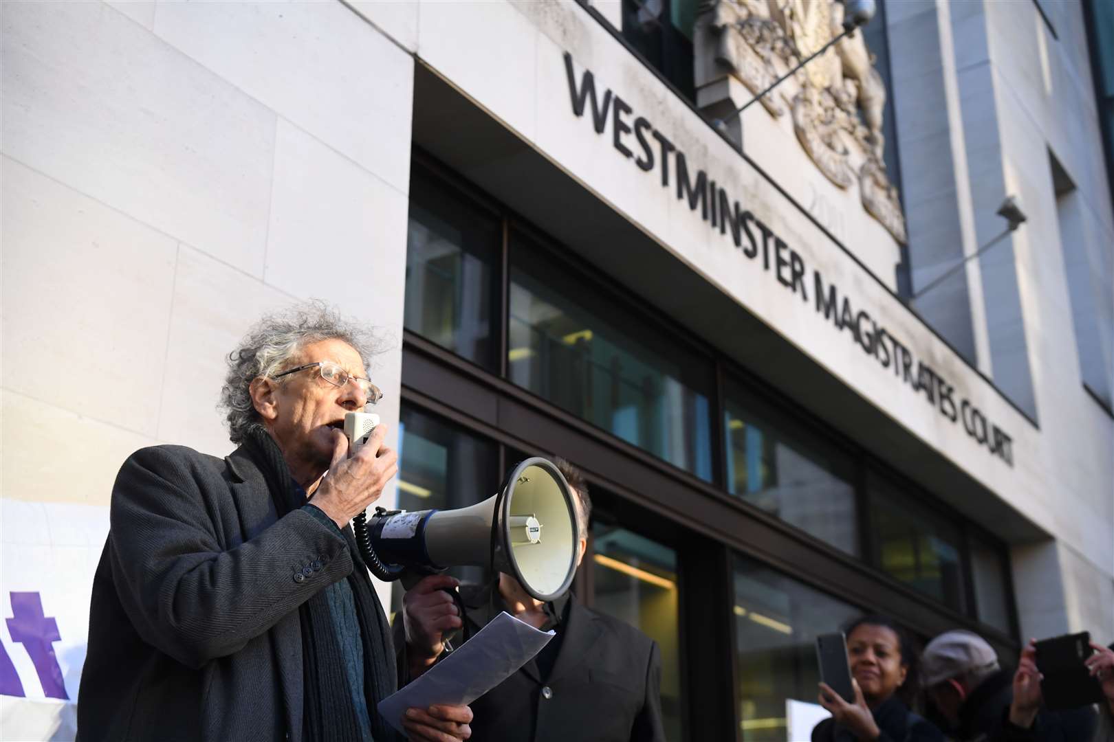 Piers Corbyn speaks to supporters as he arrives at Westminster Magistrates’ Court (Kirsty O’Connor/PA)