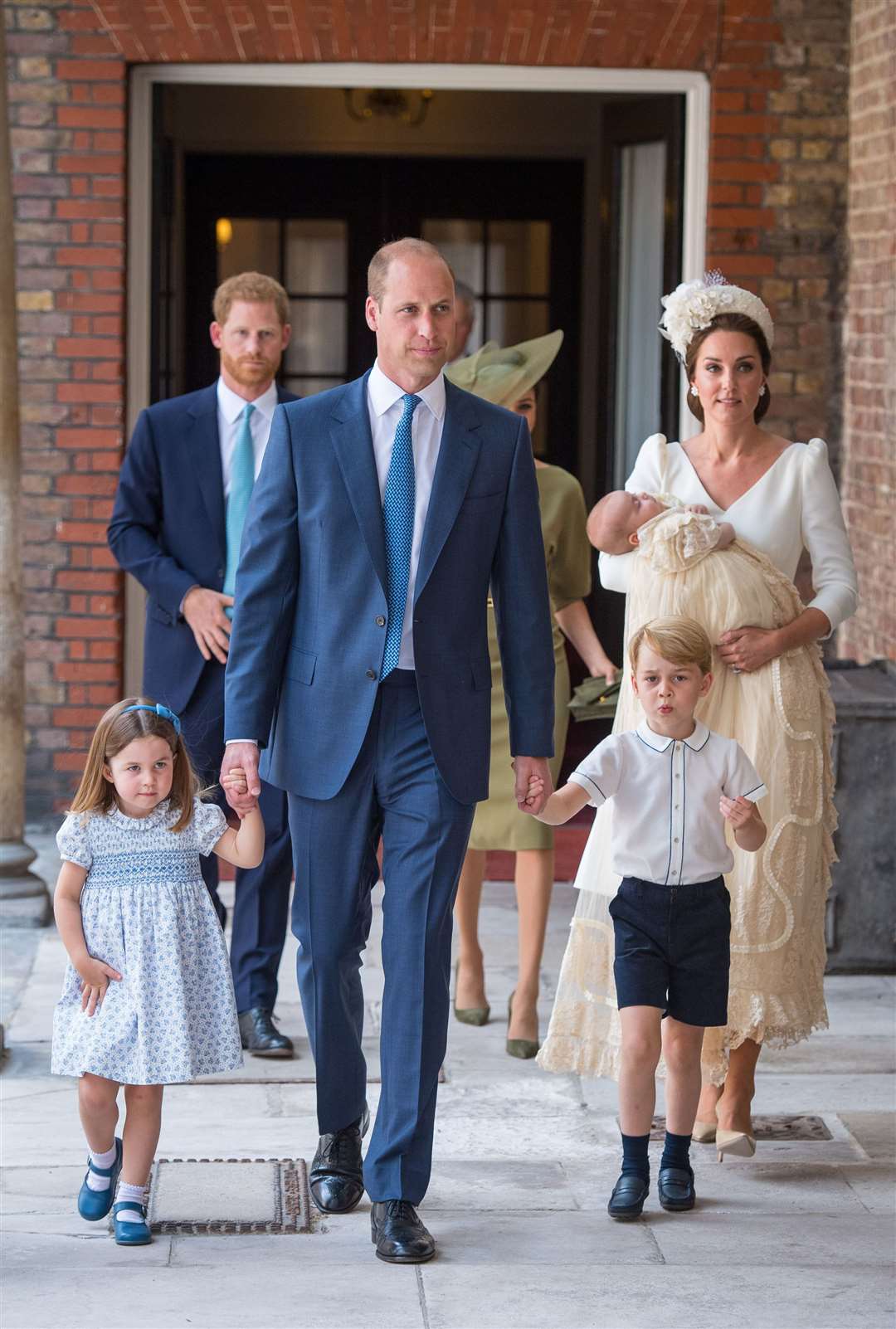 But he seemed more at ease when the whole family were pictured together for the first time at the christening (Dominic Lipinski/PA)