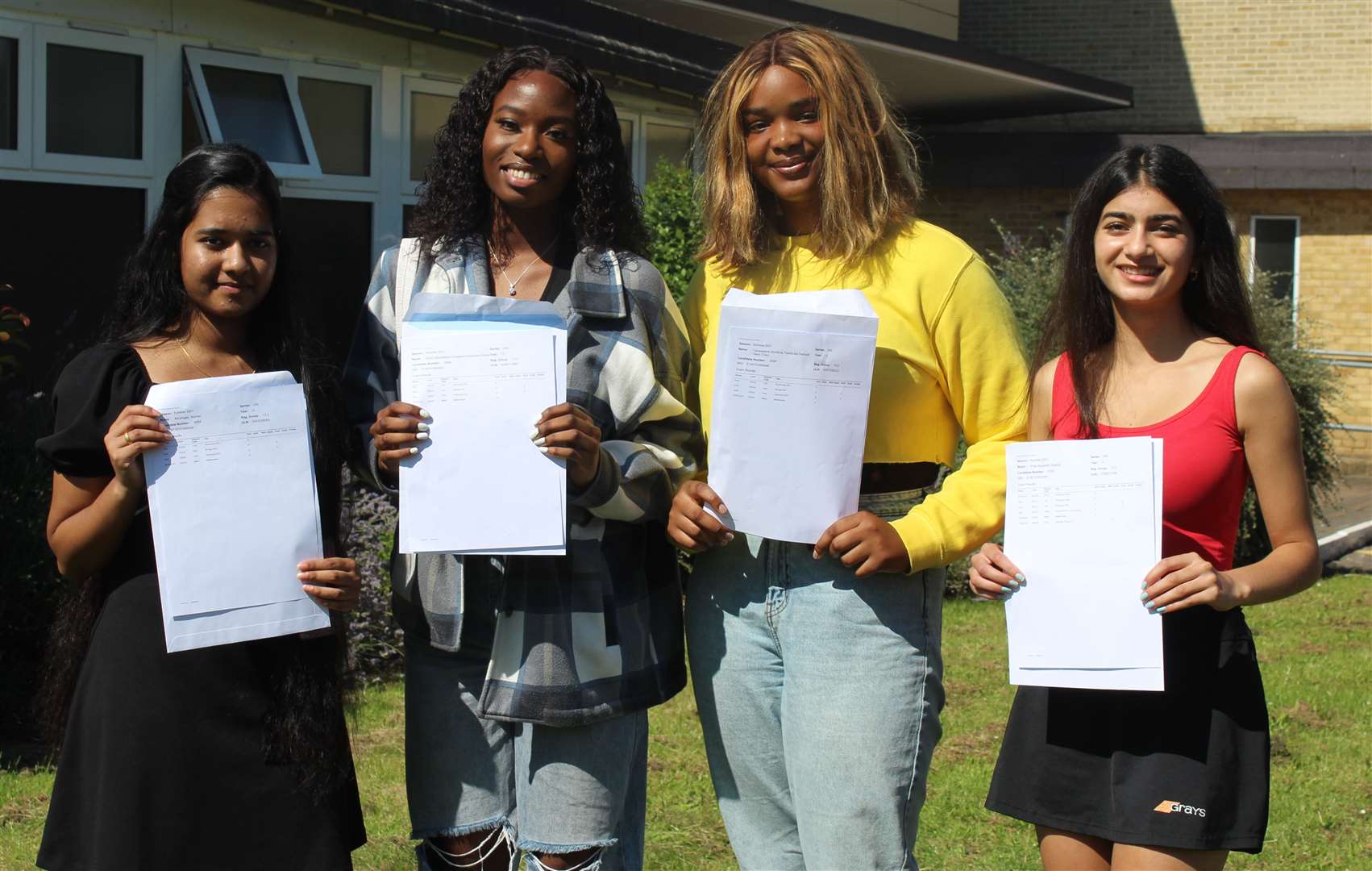 Kiruthigaa Arunan, Imani Irinoye, Toluwalashe Oseni and Preet Sharma celebrating their A-level results at Highsted Girls Grammar School, Sittingbourne