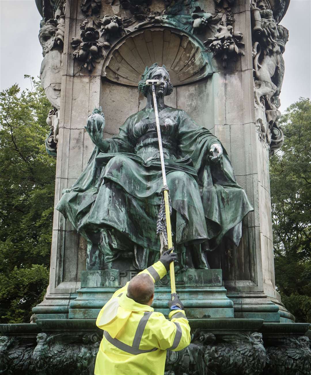 Council workers clean graffiti from a statue of Queen Victoria in Woodhouse Moor in Leeds (Danny Lawson/PA)