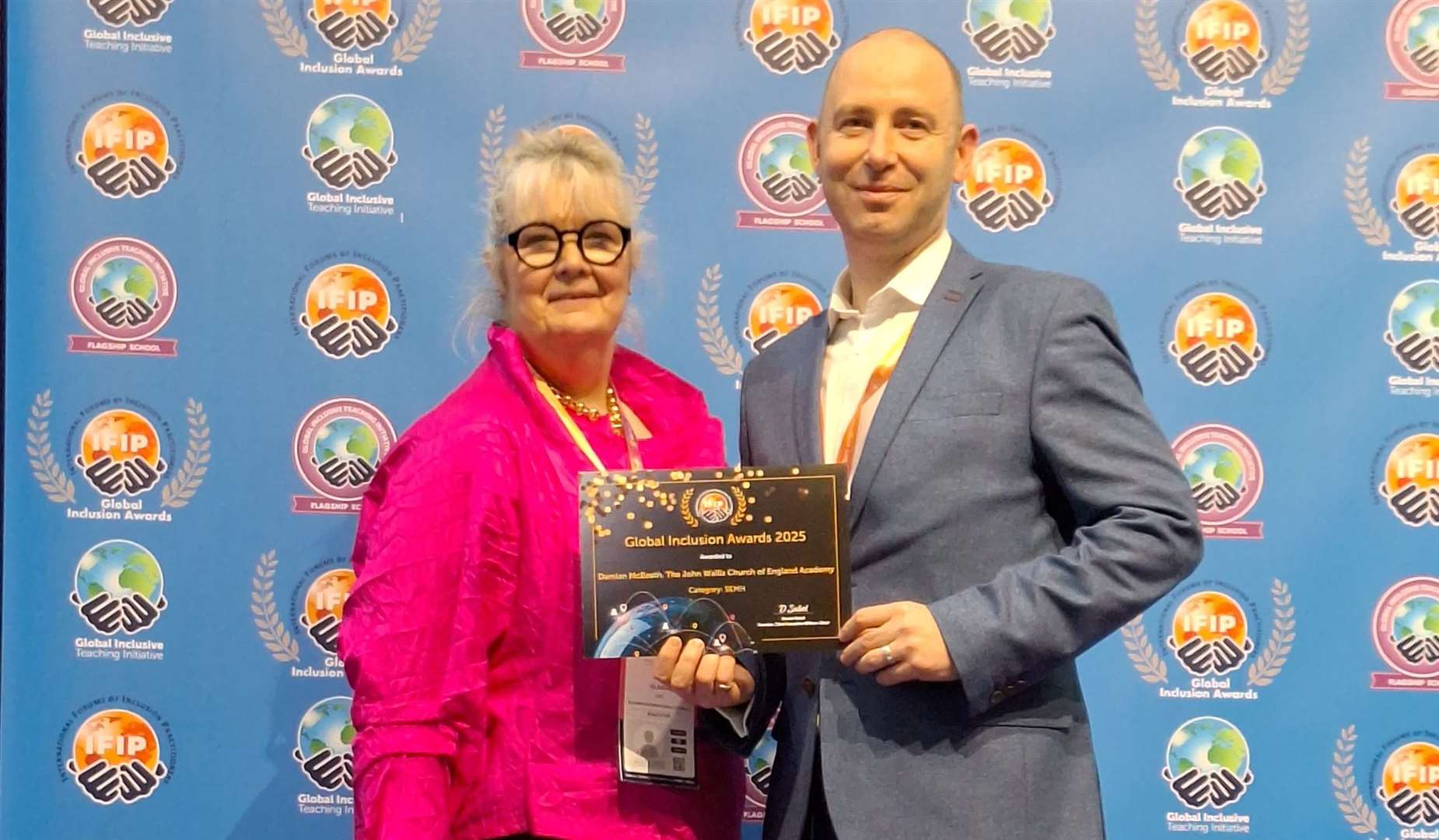 Head teacher of The John Wallis Academy Damian McBeath accepting a Global Inclusion Award. Picture: TJWA