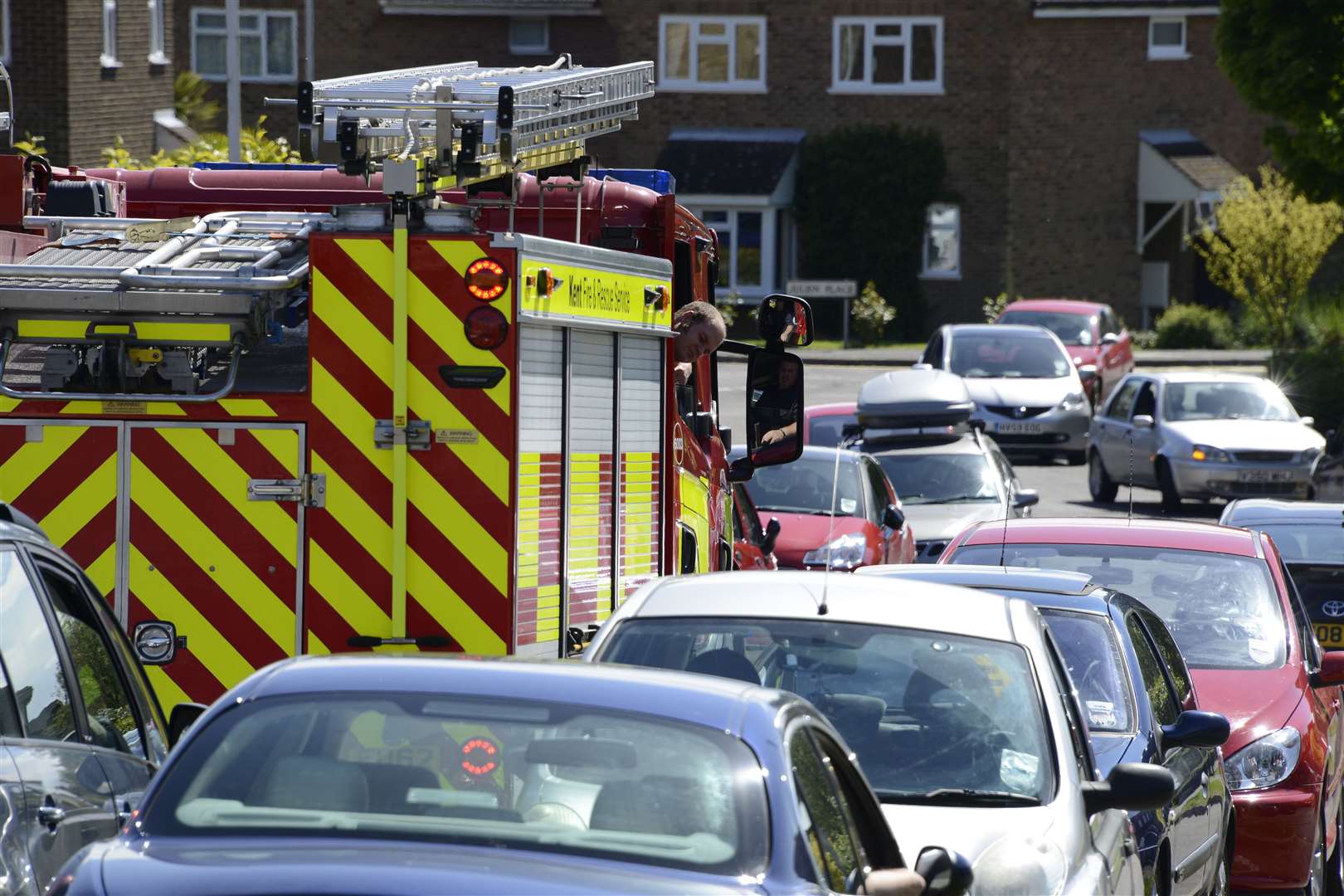 Fire engines are continuously struggling to pass narrow roads. Photo taken in 2014 when crews went to Willesborough in Ashford to encourage parents not to park near the school - but were then unable to stop or get very far due to the inconsiderate parking. Picture: Paul Amos