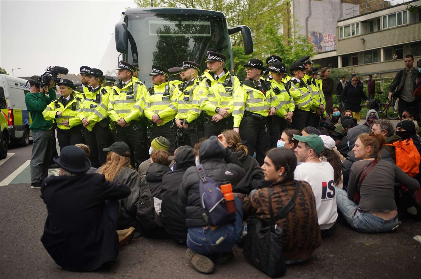 Protesters formed a blockade around the coach which was set to take asylum seekers to the Bibby Stockholm barge (Yui Mok/PA)