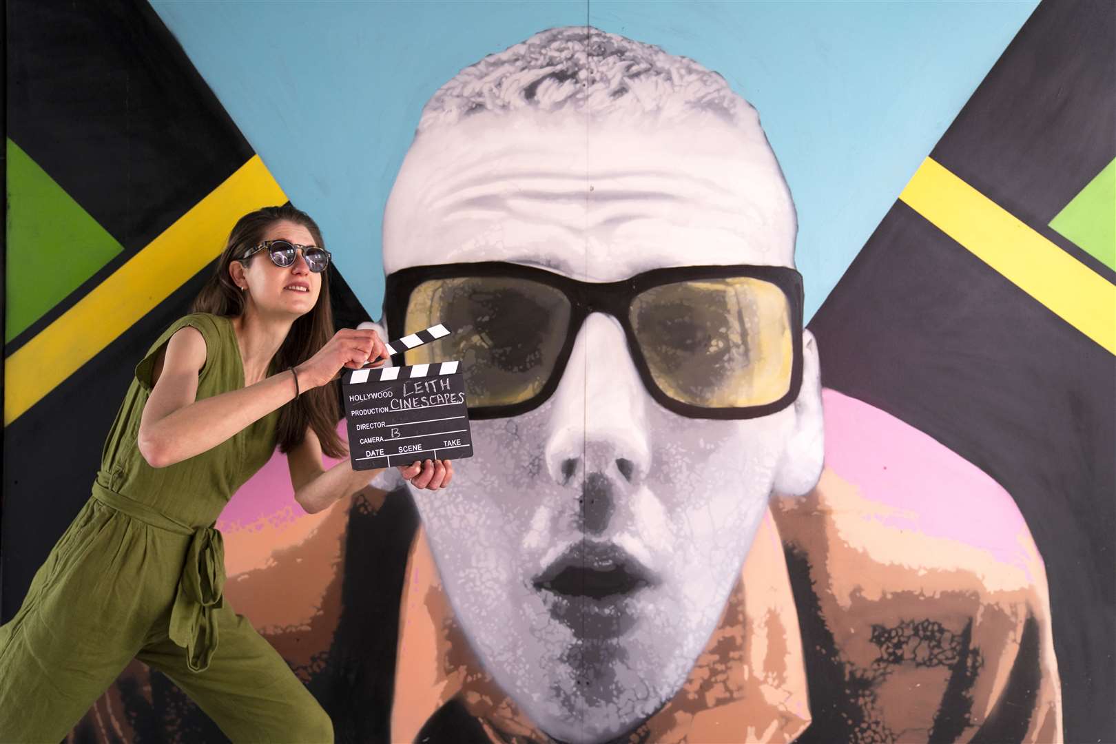 Isobel Salamon poses alongside the Leith Trainspotting murals (Jane Barlow/PA)