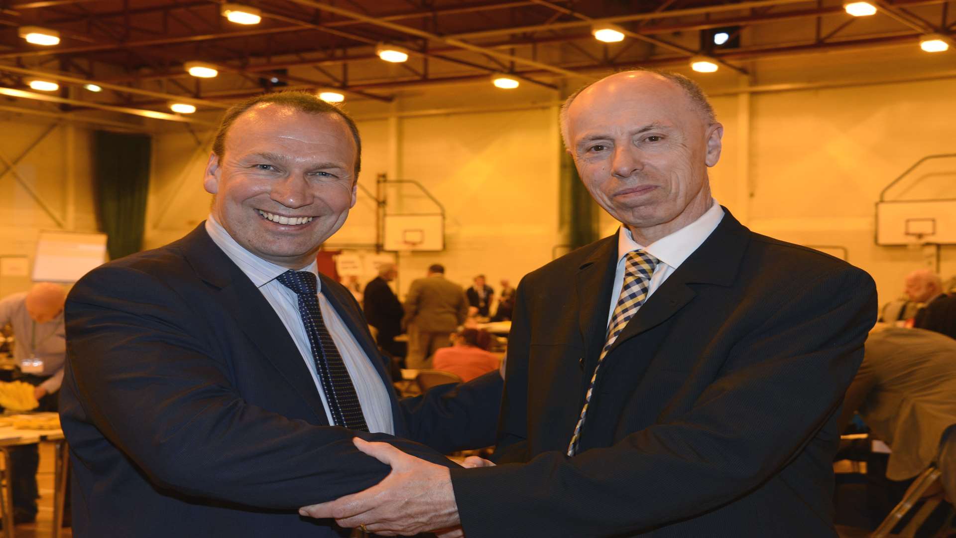 New Cllr Luke Powell is congratulated by Michael Claughton, who stepped down in Bockhanger ward. Picture: Paul Amos