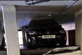 A VW wedged between floors of the car park. Pic: @Kent_999s