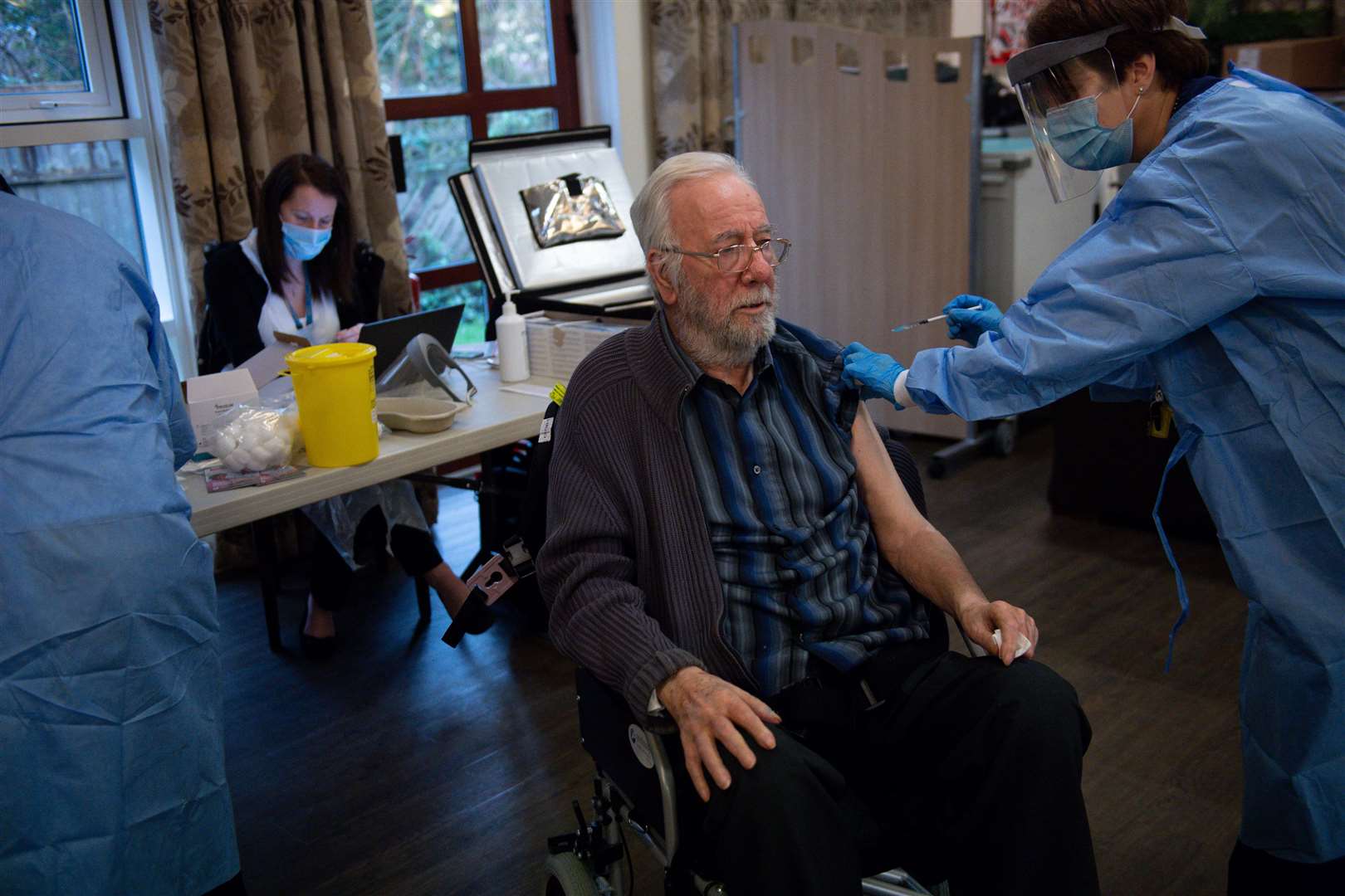 A care home resident receives a coronavirus vaccine (Jacob King/PA)