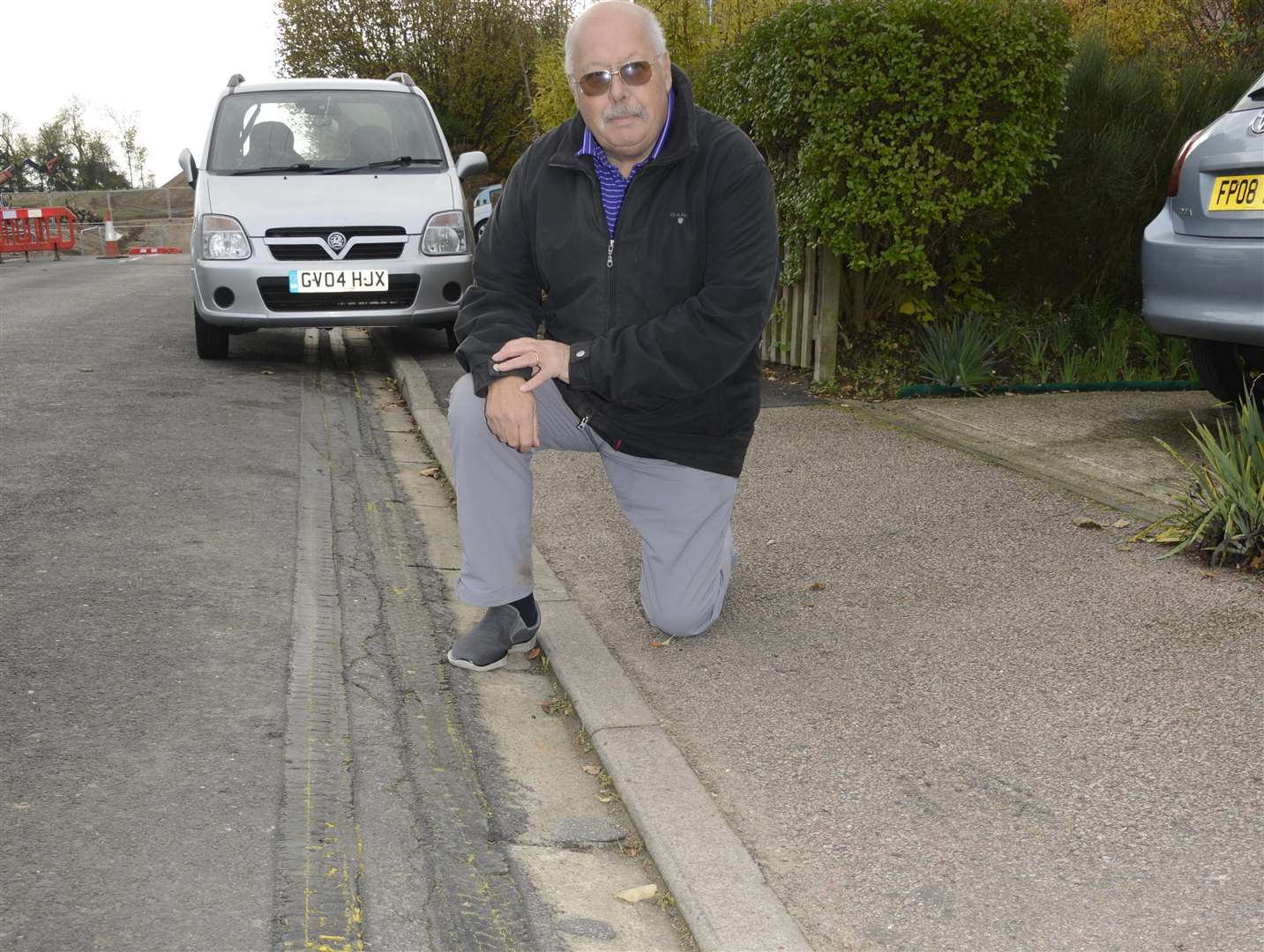 Double yellow lines were painted then covered up near the new housing development