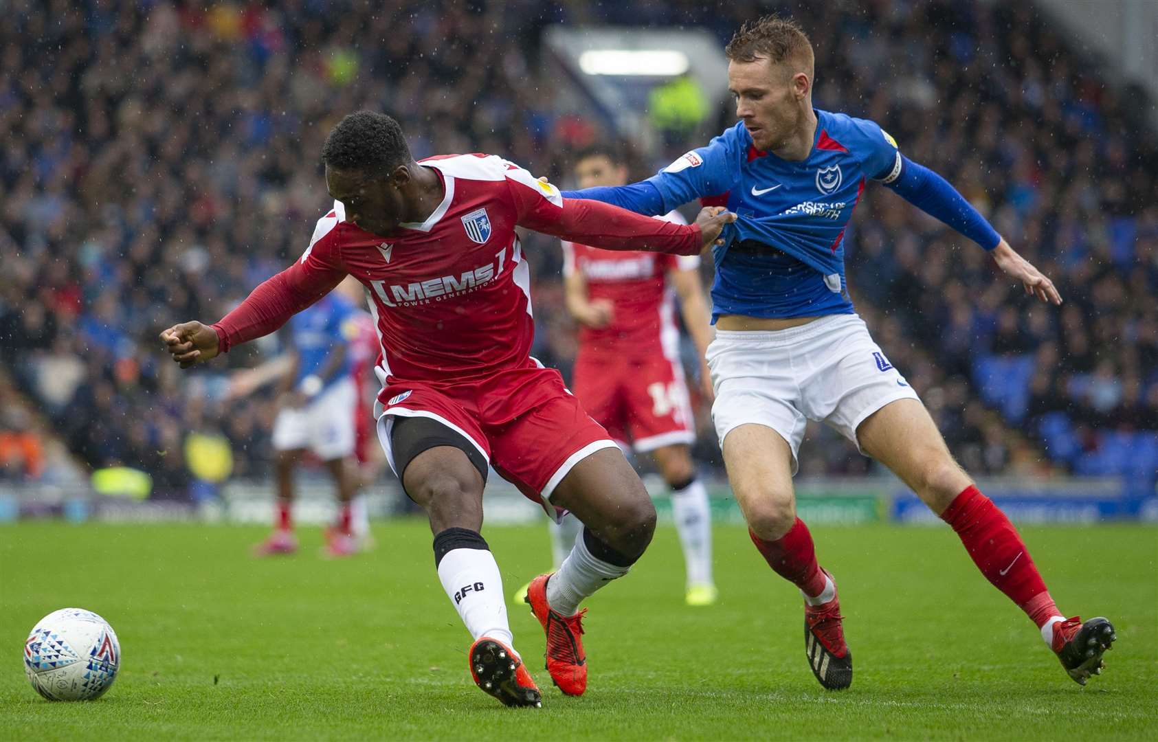 Gills' Brandon Hanlan holds off Tom Naylor Picture: @KentProImages