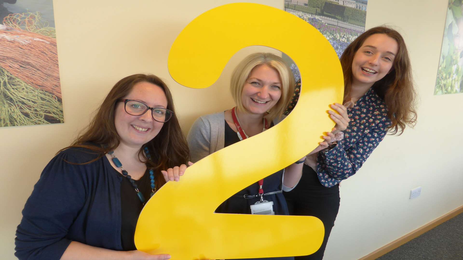 Polly Viccars of Kent Reliance, Sarah-Jane Leipnik of Golding Homes and Vicki Lyden of The Canterbury Tales celebrate Buster’s Book Club and Reading Bug pupils reaching two million minutes of reading.