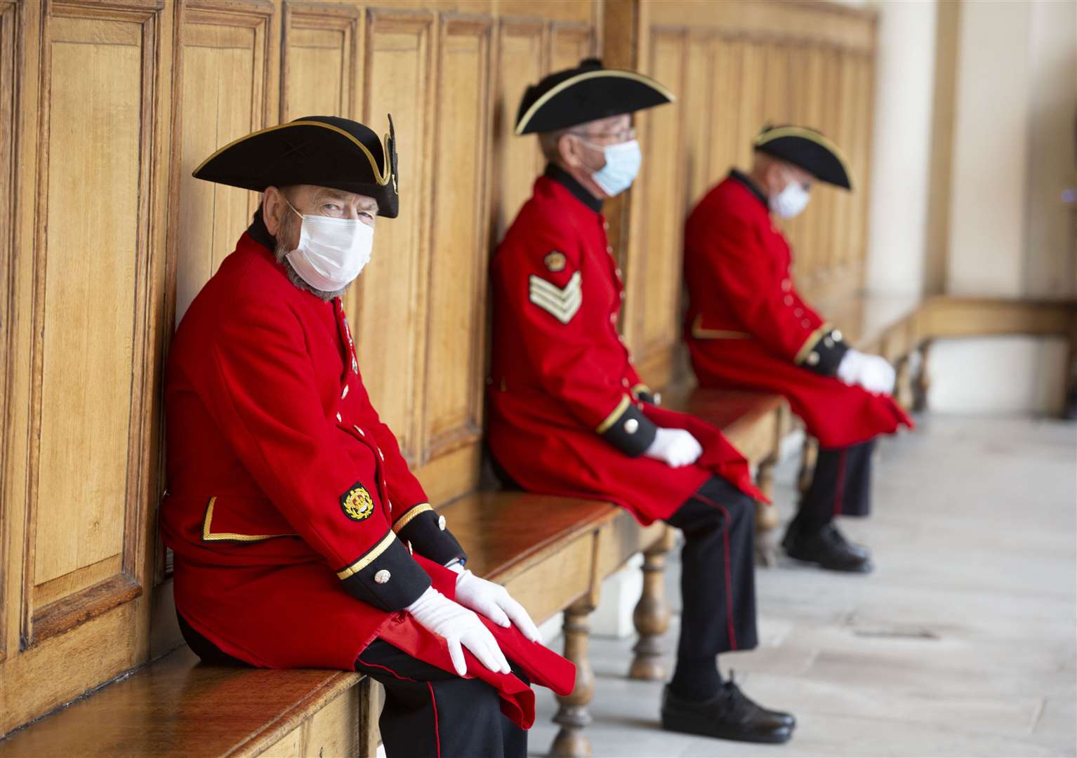 Chelsea Pensioners wearing face masks at the Royal Hospital Chelsea in London (Steve Reigate/Daily Express/PA)