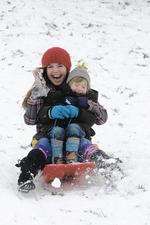 Rhiannon Martin and Lewin Martin sledging