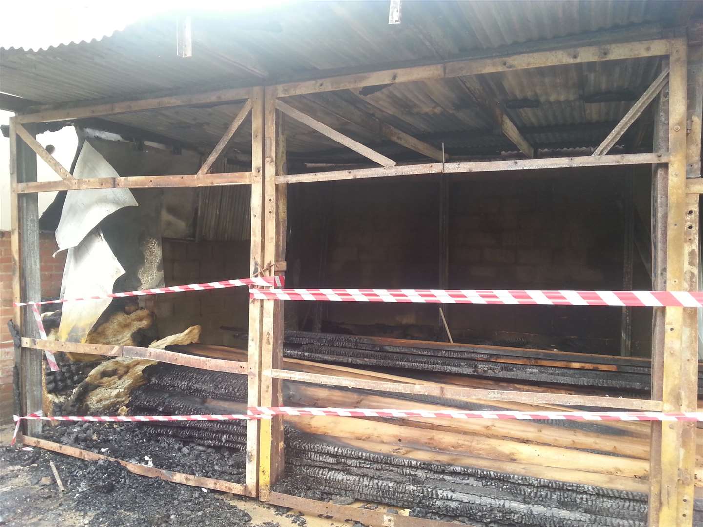 A building in Queen Street, Gravesend, used to store a large quantity of stacked timber, was damaged in a fire last night.