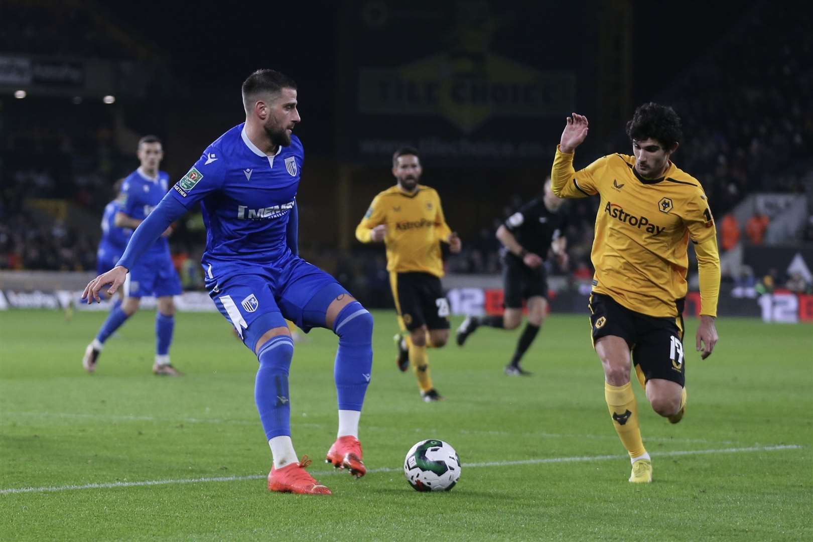 Max Ehmer with the ball for Gillingham as Wolves look for a goal