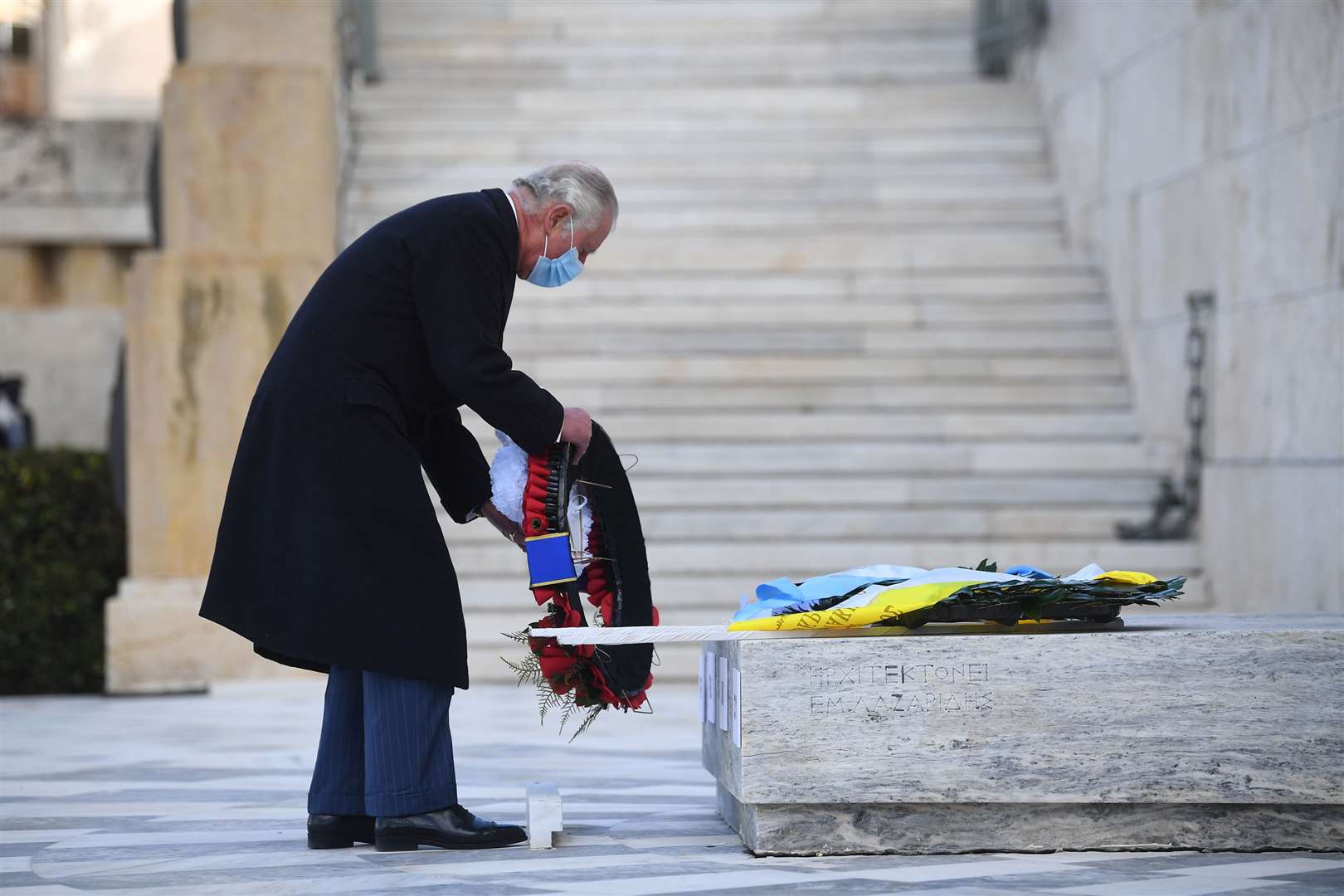 The Prince of Wales lays a wreath at the Memorial of the Unknown Soldier in Syntagma Square, Athens (Victoria Jones/PA)