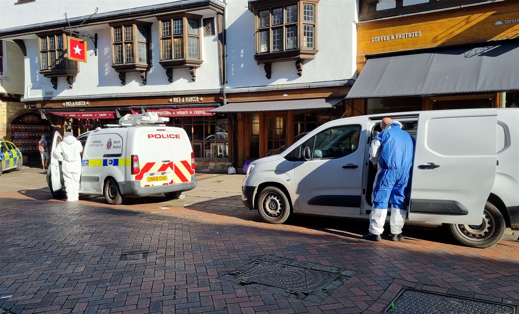 Forensics were seen working in Canterbury High Street after the suspected murder probe was launched