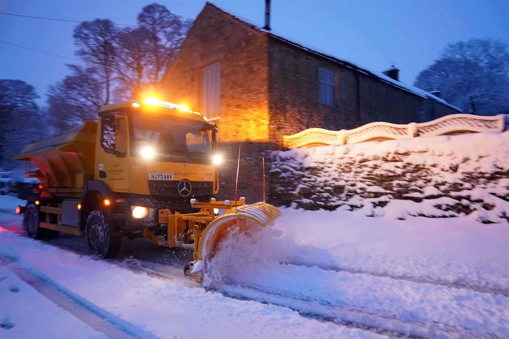 A snowplough tackles heavy overnight snow in Carrshield in the Pennines (Owen Humphreys/PA)