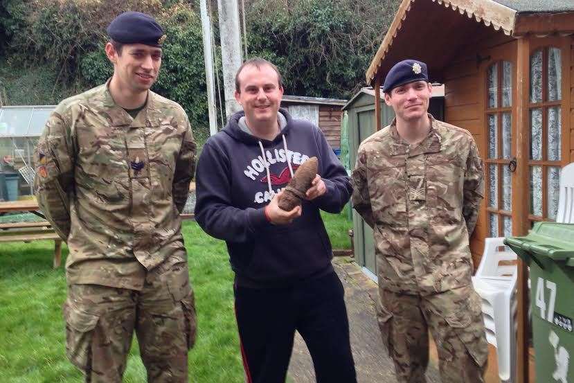 Gary Underdown holding the bomb he found on Boxing day 2014